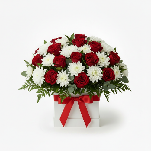Coconut Grand - grand luxurious white chrysanthemums, red roses and greenery in a white posy box with red ribbon